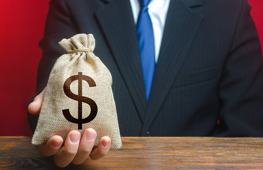 Man Gives A Dollar Money Bag. Loan Issuance. Financial Support,